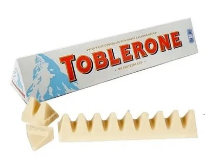 Швейцарський білий шоколад TOBLERONE з медом та мигдальною нугою, 100 г, 20 шт/ящ 1689006079 фото